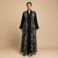 black abaya with an elegant geometric pattern.