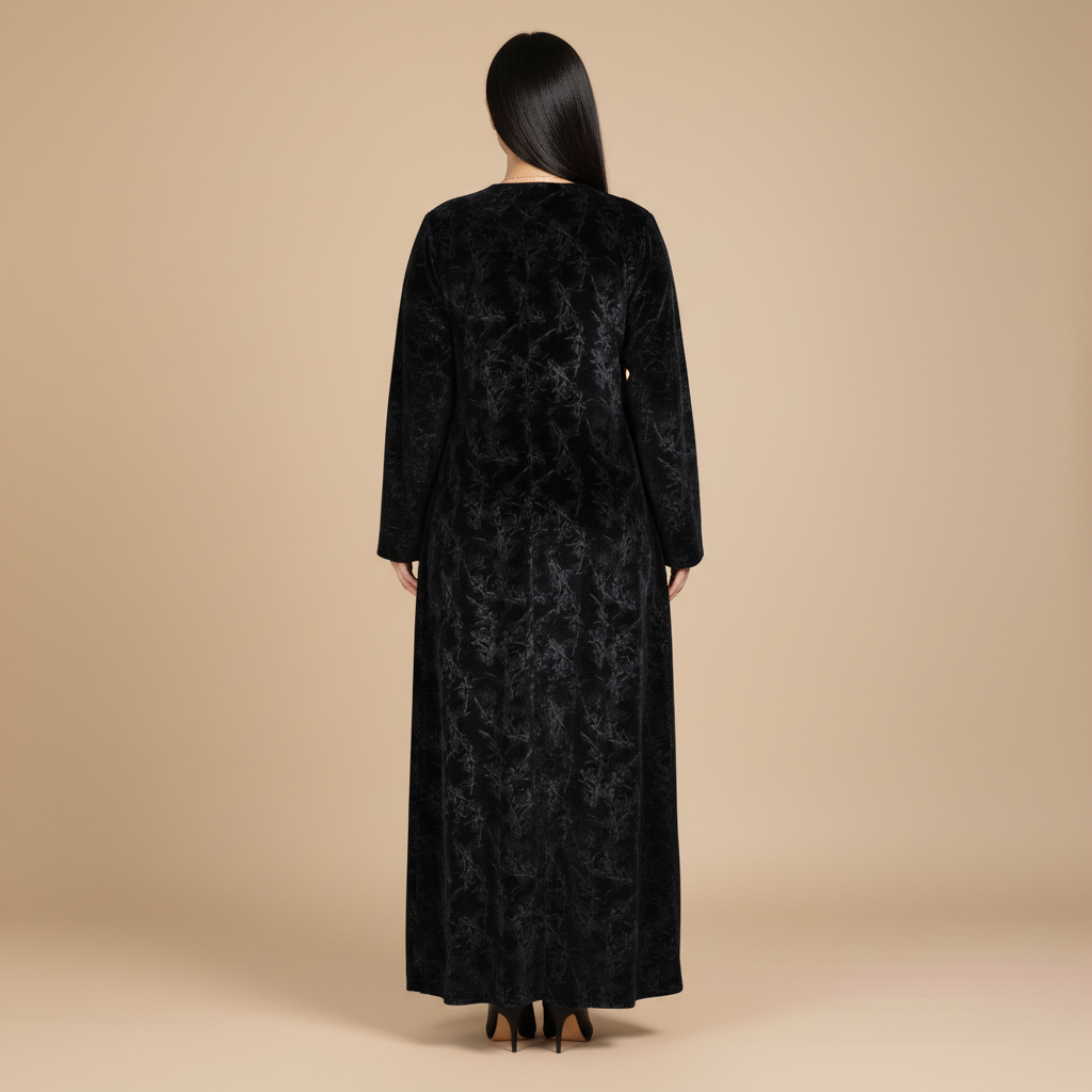 black cold-velvet abaya with botanical pattern.