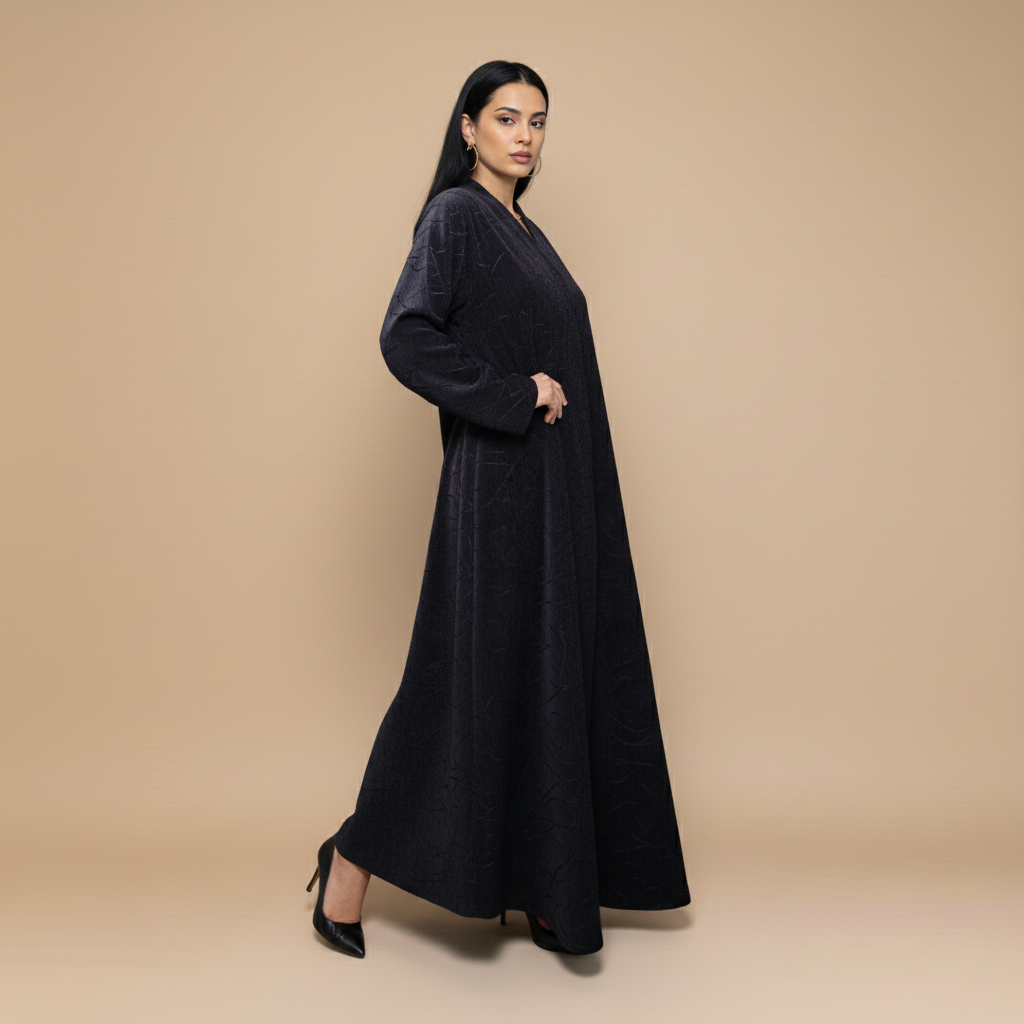 A velvet abaya with a subtle pattern.