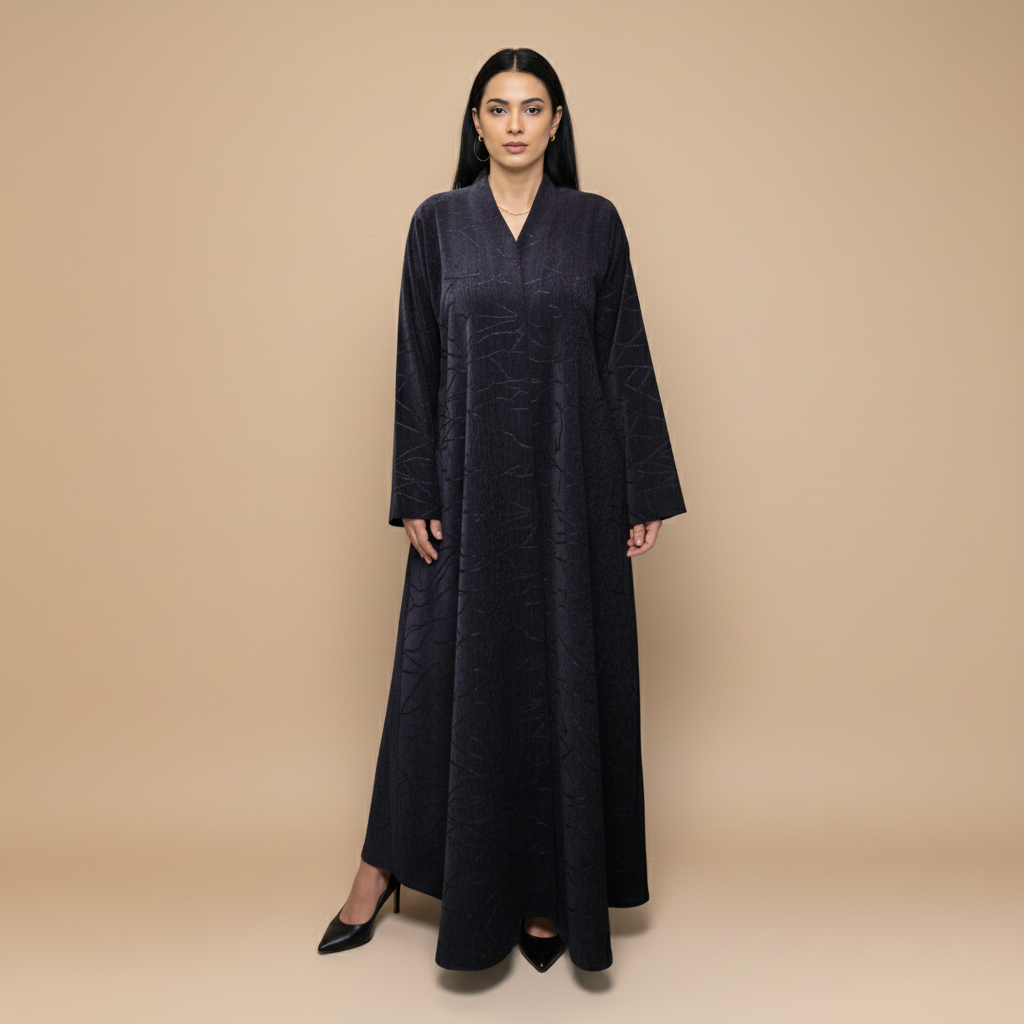 A velvet abaya with a subtle pattern.