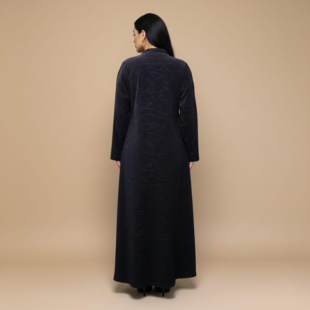 A velvet abaya with a subtle pattern.