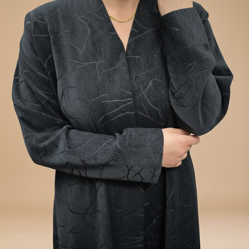 A velvet abaya with a subtle pattern.