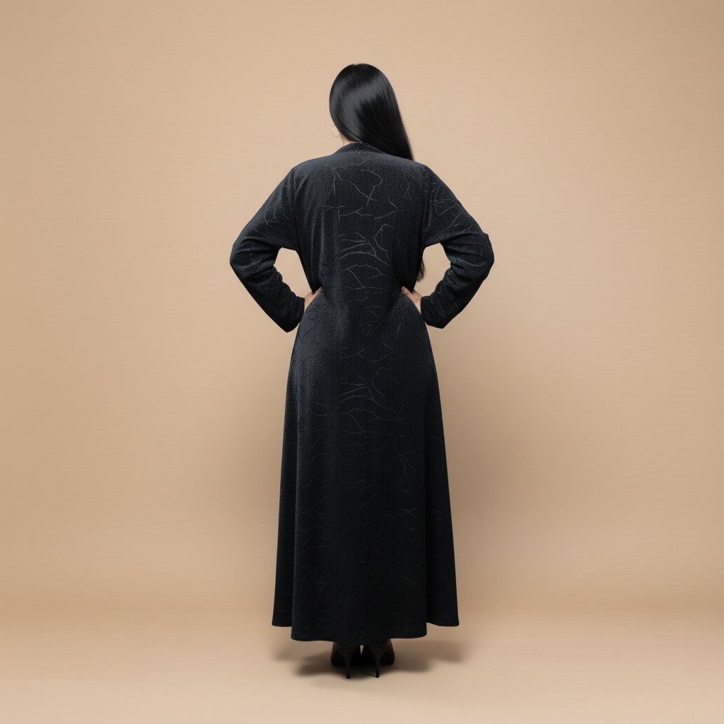 A velvet abaya with a subtle pattern.